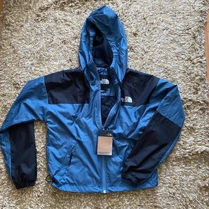 blue north face zip up wind breaker